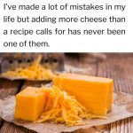 A block of cheddar cheese with shredded cheese on parchment paper, with a humorous quote about adding extra cheese.