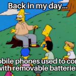Cartoon character reminiscing about phones with removable batteries.