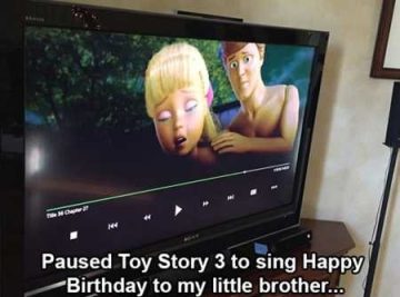Hilarious paused scene from Toy Story 3 showing an awkward moment on TV.