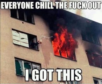 A person casually reaching out of a burning building, acting unfazed.