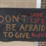 Sign with funny blood donation fail message on a board.