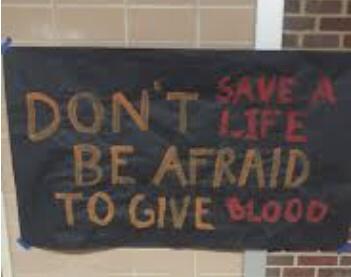 Sign with funny blood donation fail message on a board.
