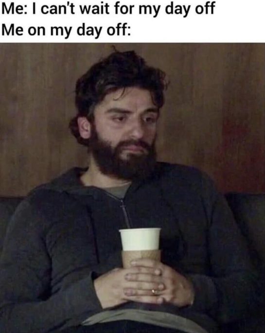 Tired man on sofa holding cup, reflecting day off meme humor.