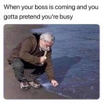 Man pretending to hammer nails into the beach