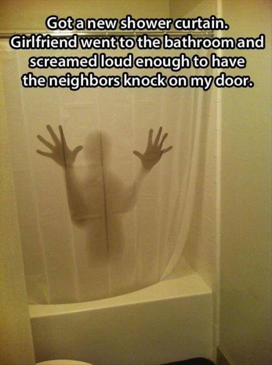 Shadowy figure behind shower curtain causing hilarious reaction