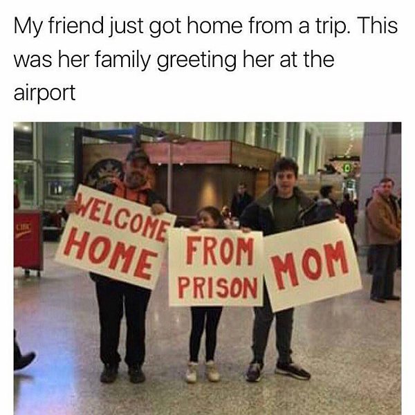 Family holds humorous welcome sign at airport