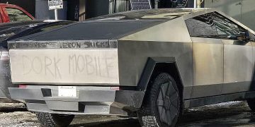 Cybertruck labeled as Dork Mobile on snowy street.