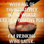 Glass of red wine with text about drinking wine as positivity.