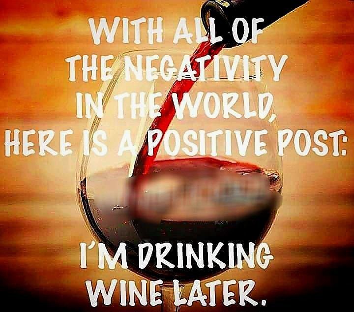 Glass of red wine with text about drinking wine as positivity.