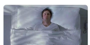 Person awake in bed ready to get up but staying put.