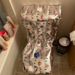 Toilet humor taken literally with a fully gift-wrapped toilet.