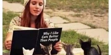 Woman reading to kittens, humorously envisioning her future.