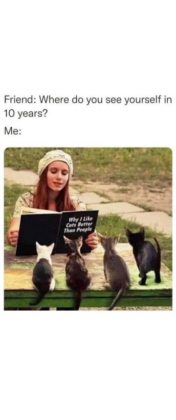 Woman reading to kittens, humorously envisioning her future.