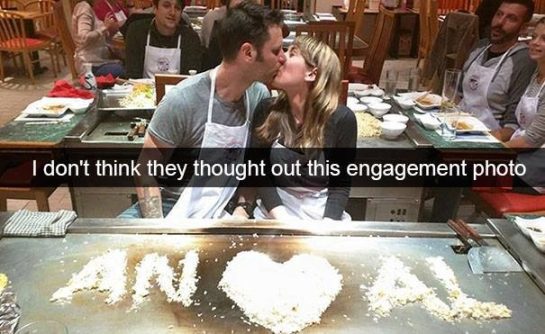 Couple kisses in front of funny engagement rice message mistake.