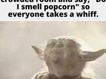 Yoda enjoying the smell after a fart prank in a crowded room.