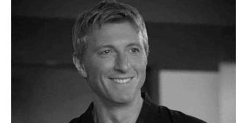 Guy smiling after pretending to be a karate teacher