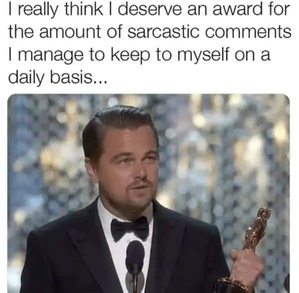 Man holding award with caption about deserving an award for sarcasm.