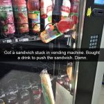 Sandwich and drink stuck in a vending machine in a comical fail.