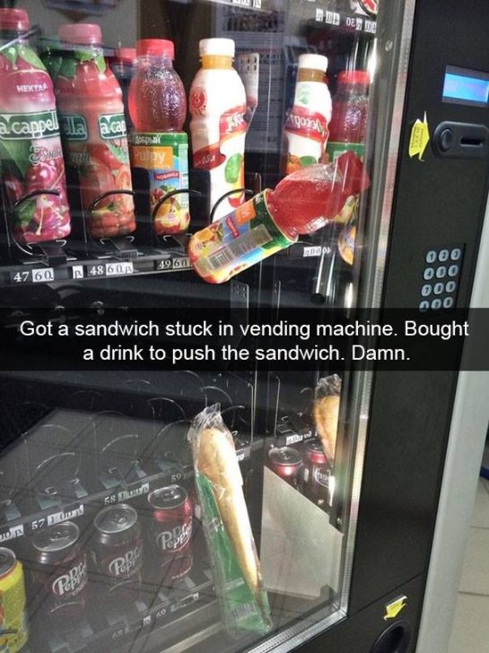 Sandwich and drink stuck in a vending machine in a comical fail.