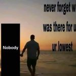 Man walks with "Nobody" at sunset, highlighting isolation.