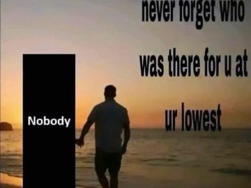 Man walks with "Nobody" at sunset, highlighting isolation.