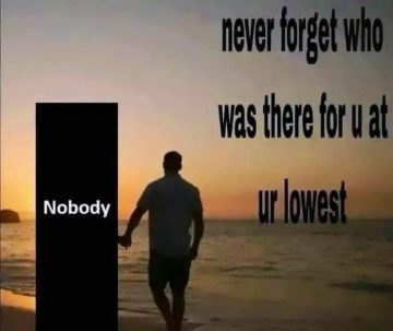 Man walks with "Nobody" at sunset, highlighting isolation.