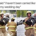 Firefighter carrying a smiling grandma through water, joyful moment.
