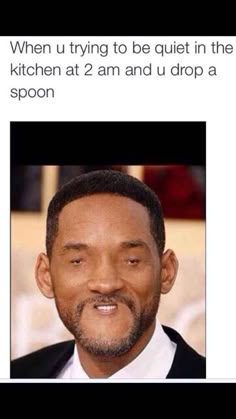 Person looking awkward after dropping a spoon at 2 am in kitchen