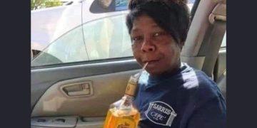 Person with tequila bottle playfully answering how work was.