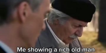 Person showing AI-generated family photo to an elderly man.