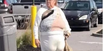 Woman looking disheveled after turning too fast in a parking lot.