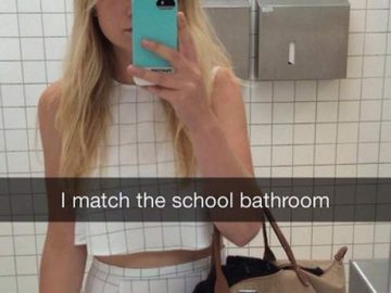 Woman in white outfit blending into school bathroom tiles mirror selfie