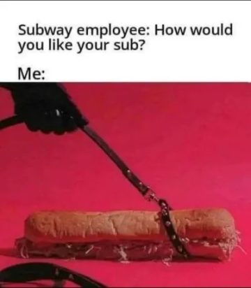 A sub sandwich humorously strapped with a belt on pink background.