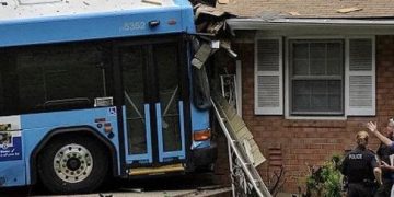 Bus crashes into house as hilarious driving fail meme.