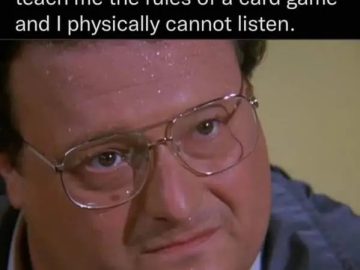 Person sweating as friends teach card game rules, looking confused