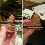 Hand holding chocolate-shaped soap mistaken for a cake.