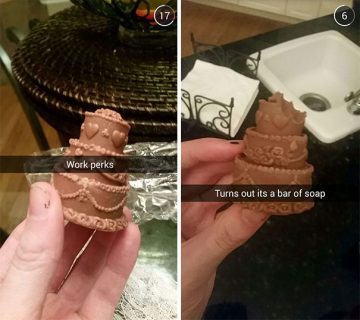 Hand holding chocolate-shaped soap mistaken for a cake.