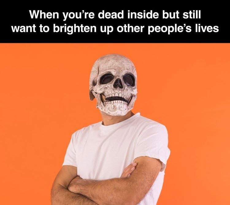 Person wearing a skull mask with a humorous caption about being dead inside.