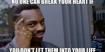 Man pointing to his head with text about avoiding heartbreak.