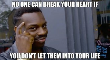 Man pointing to his head with text about avoiding heartbreak.