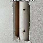 DIY drilling mistake piercing a pipe behind a wall for TV installation.