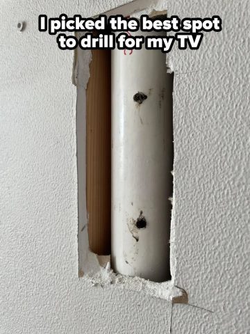 DIY drilling mistake piercing a pipe behind a wall for TV installation.