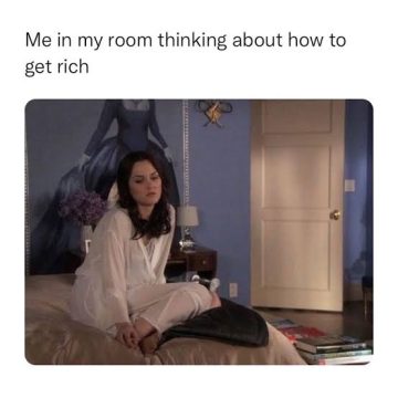 Woman in room pondering how to get rich, looking thoughtful.