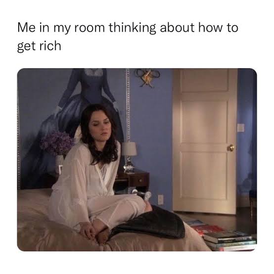 Woman in room pondering how to get rich, looking thoughtful.