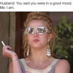 Woman with sunglasses and cigarette, captioned "I'm in a good mood."