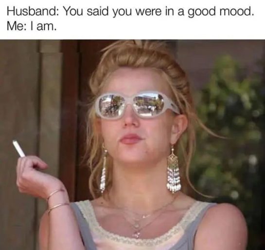 Woman with sunglasses and cigarette, captioned "I'm in a good mood."