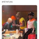 Guy feeling left out as friends talk to girls instead