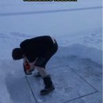 Person cutting a square in ice, about to experience a fail.