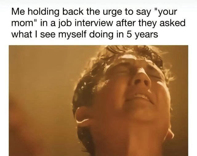 Person struggling to hold back a joke in a job interview.