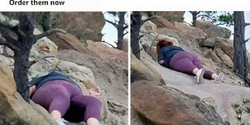 Person stuck on rocks reviewing leggings durability with humor.